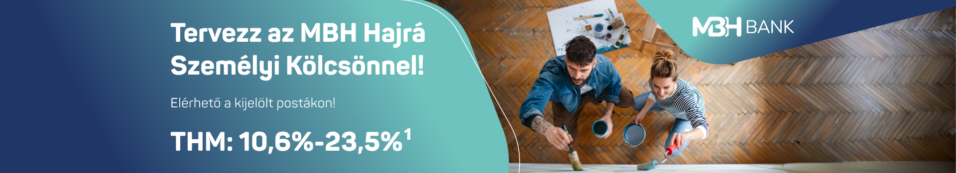 A képen egy fiatal pár látható falfestés közben